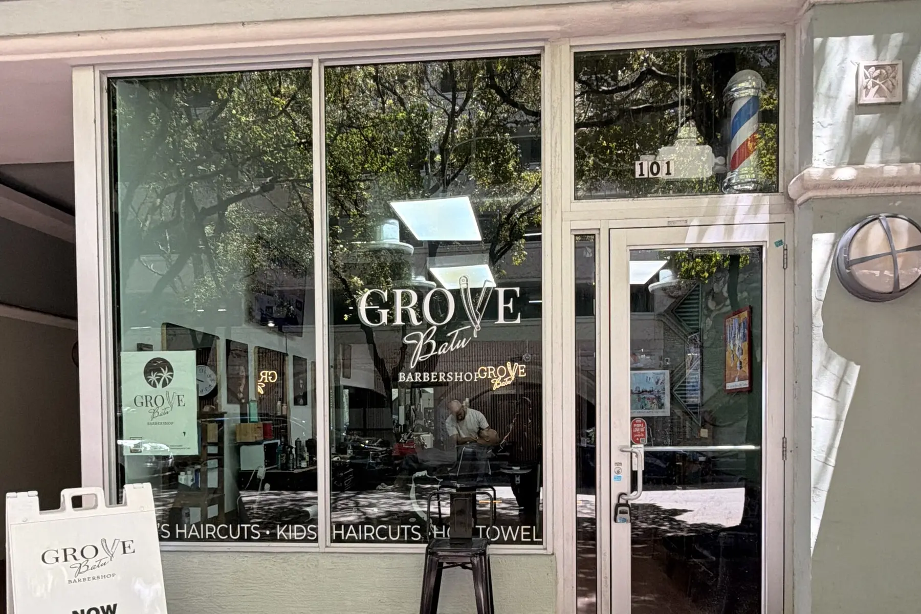 Grove Batu Barbershop storefront on Rice Street, Coconut Grove, with the walk-ins sign out front