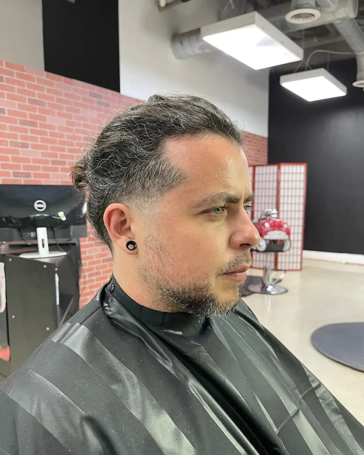Finished fade and textured top on a client at Grove Batu Barbershop