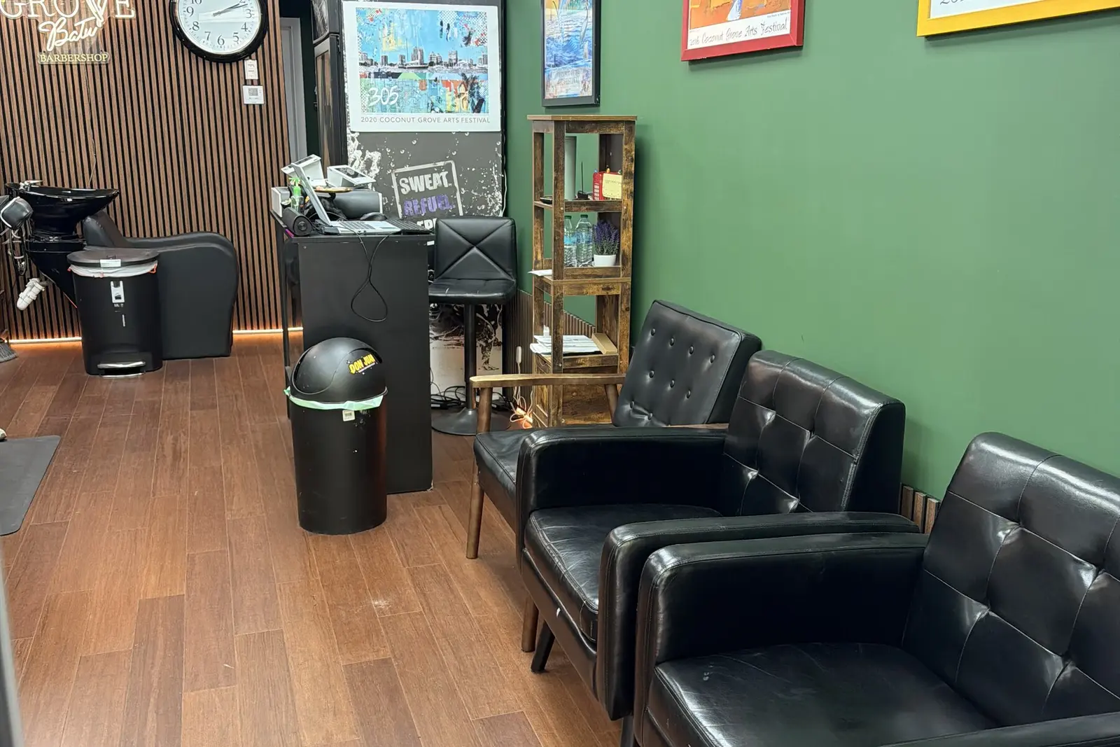The waiting area at Grove Batu Barbershop in Coconut Grove